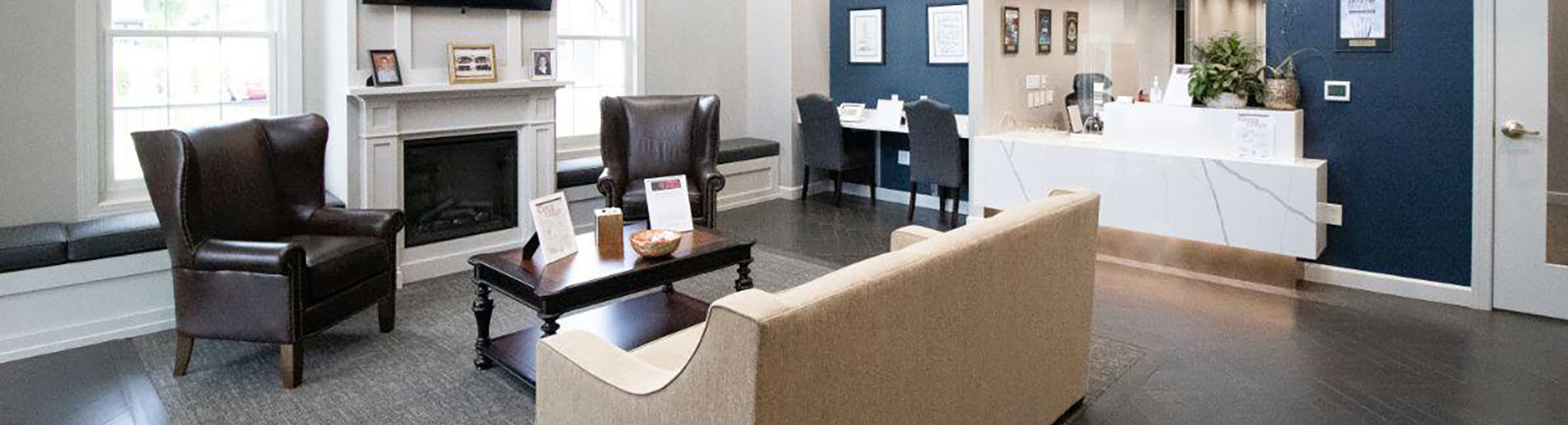 The image shows a modern dental clinic interior with various pieces of equipment, including a dental chair and an X-ray machine.